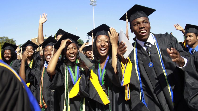 Students react during the graduation ceremony of the 2010 class at Hampton University in Virginia May 9, 2010. U.S. President Barack Obama delivered the commencement address at the graduation and was conferred an honorary doctor of laws degree.     REUTERS/Jason Reed   (UNITED STATES - Tags: POLITICS EDUCATION IMAGES OF THE DAY) - RTR2DNV8